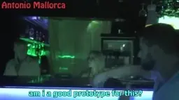 MILF kneels in fishnet stockings in front of bar, two men beside her