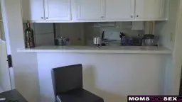 Mature woman with big tits kneels in front of man in bathroom