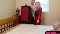Blonde woman smiles and touches men in the red room