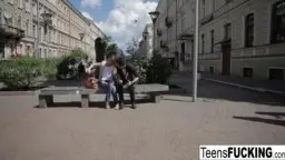 Teen girl in jeans pushed against window from behind