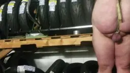 Man with tire rack and tight ball rope pull