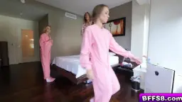 Blonde in camouflage pants taken from behind, friends sleeping next to her