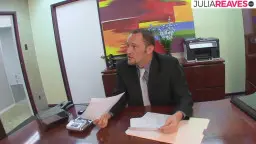Woman shows colleague her thong at the desk